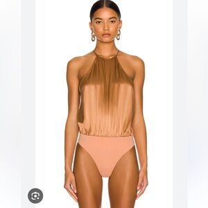 The Sri Revolve burnt orange silk bodysuit